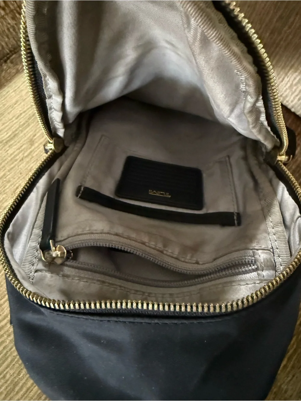 Tumi Black Sling Belt Bag with Gold Hardware